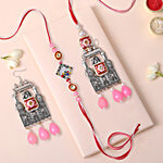FNP Bhaiya Bhabhi Jewellery Lumba Rakhi With 1 Pair Earrings - Silver & Pink 2 pcs
